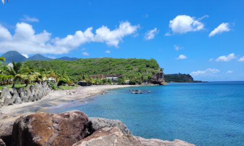 View of Little Bay beach with the Centre Hills in the distance.