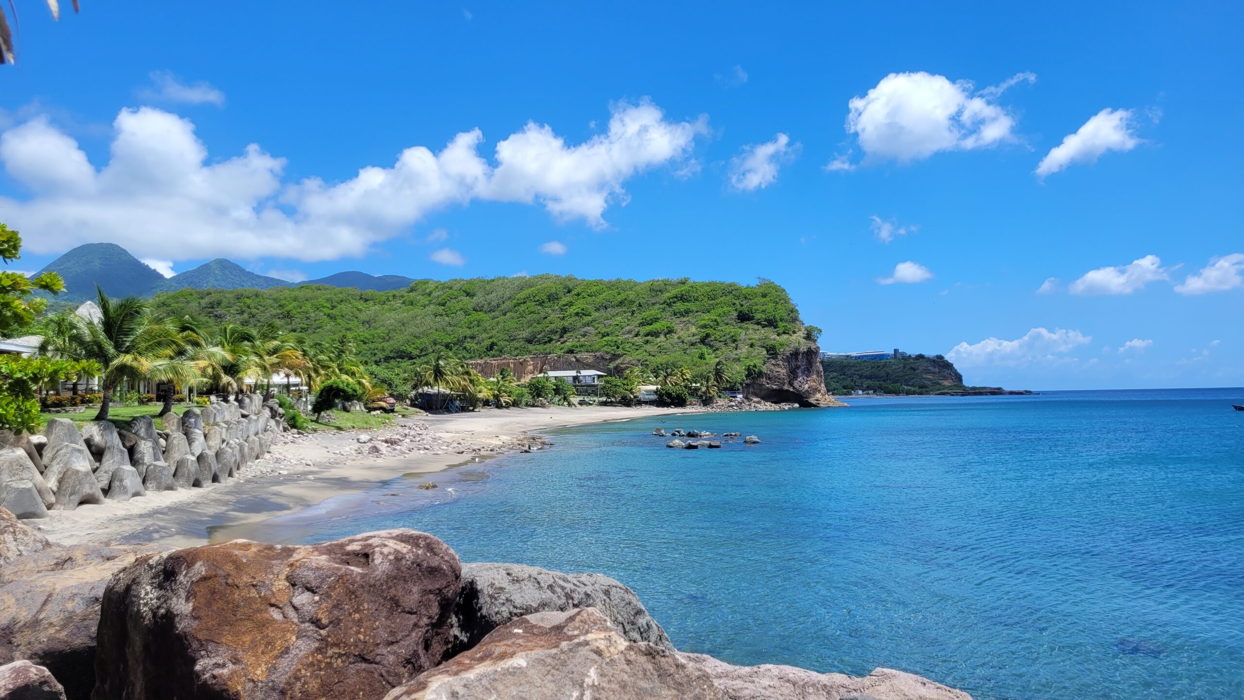 View of Little Bay beach with the Centre Hills in the distance.